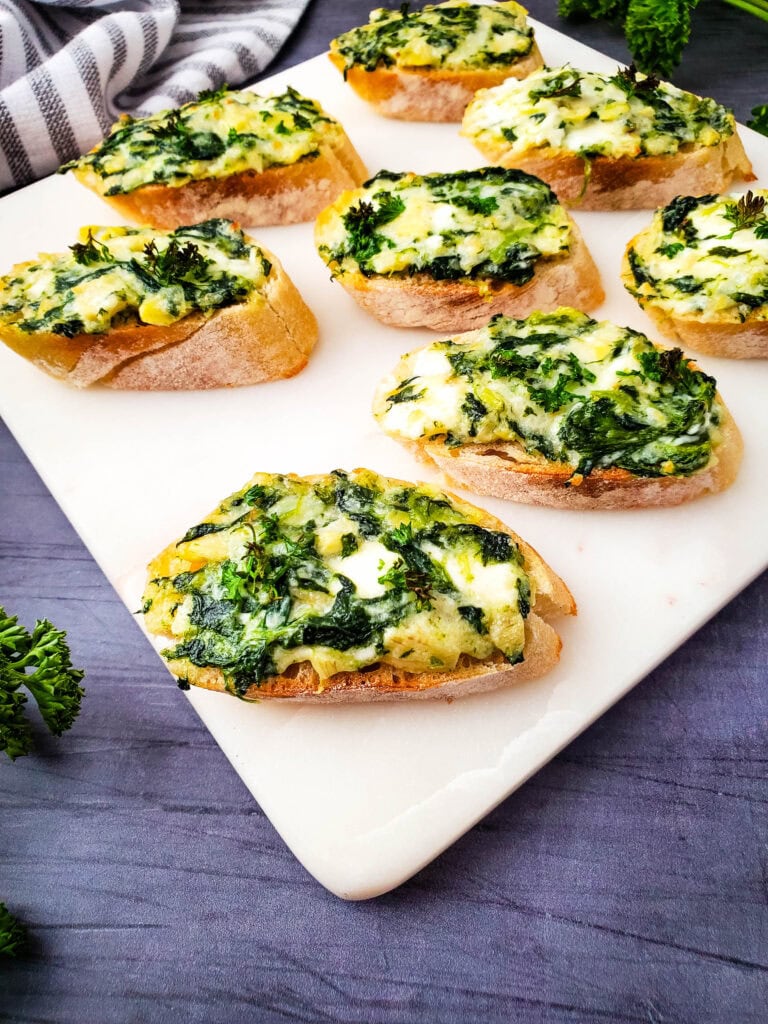 photo of the finished Spinach and Artichoke Crostini