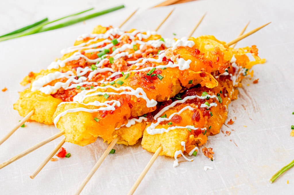 photo of the finished loaded tator tot skewers